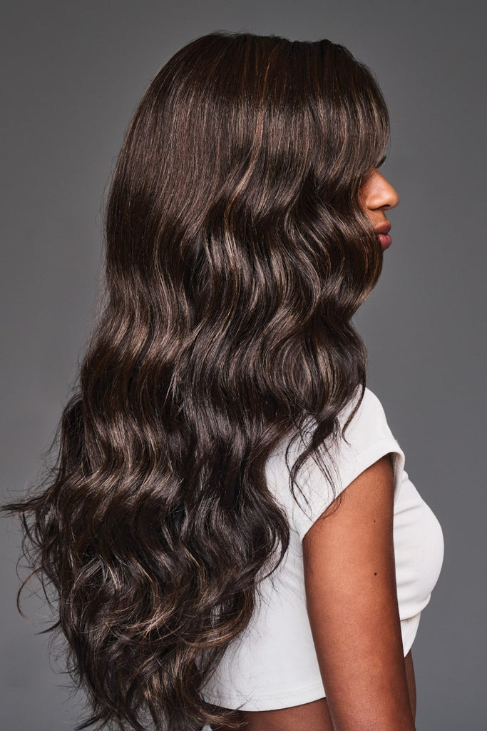 Side of Raven, showing the long lightweight layers and soft barrel curl waves.