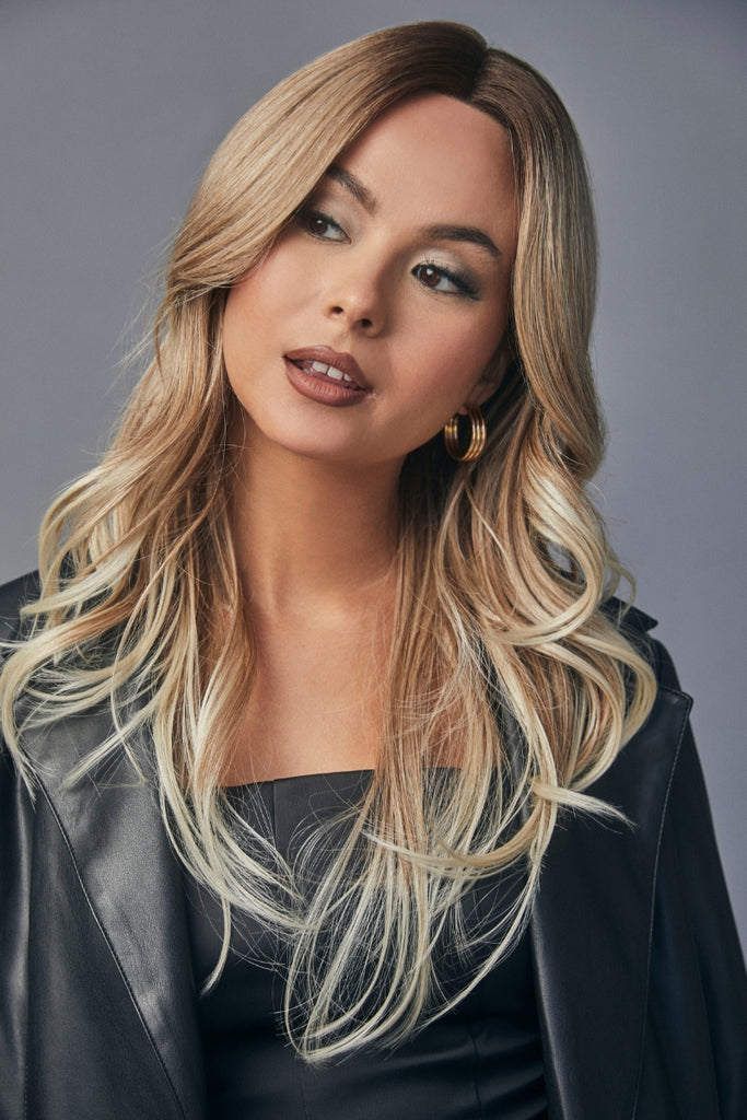 Women modeling a Dark Brown root, Golden Strawberry Blonde base, with a cool blonde tip - Ombre look.