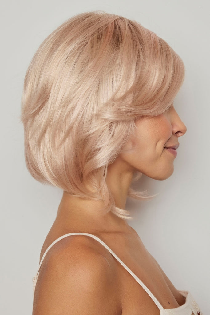 Side view of the layered bob showing the side swept bangs.