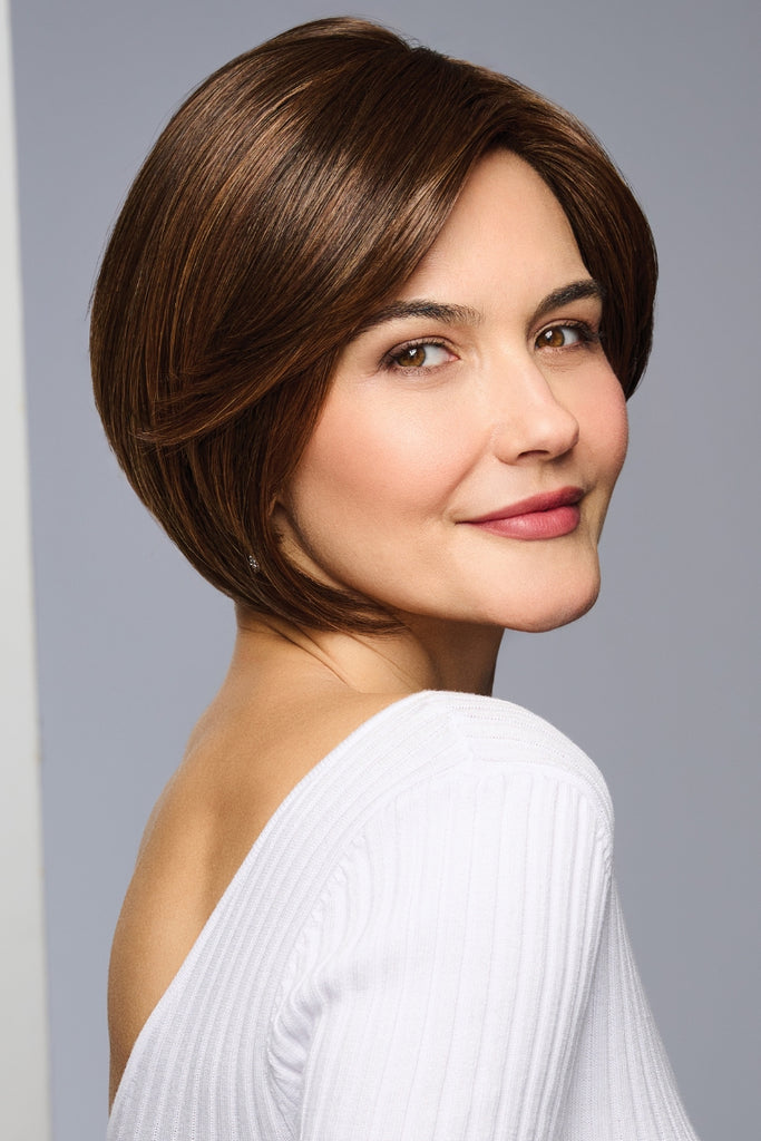 Woman wearing the 8" topper by Raquel Welch.