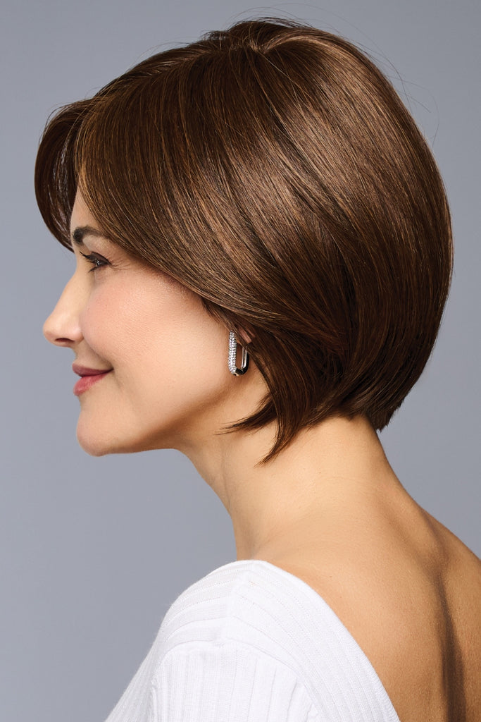 Side view of the straight heat friendly topper by Raquel Welch.