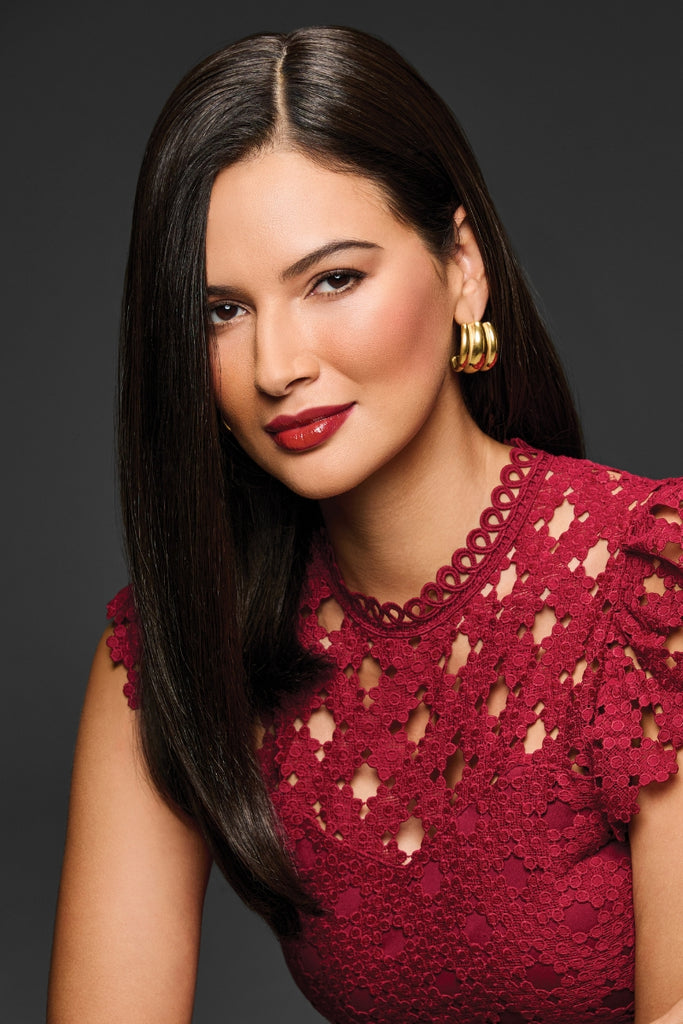 Woman wearing Unmatched 18" topper by Raquel Welch in the color Off Black.