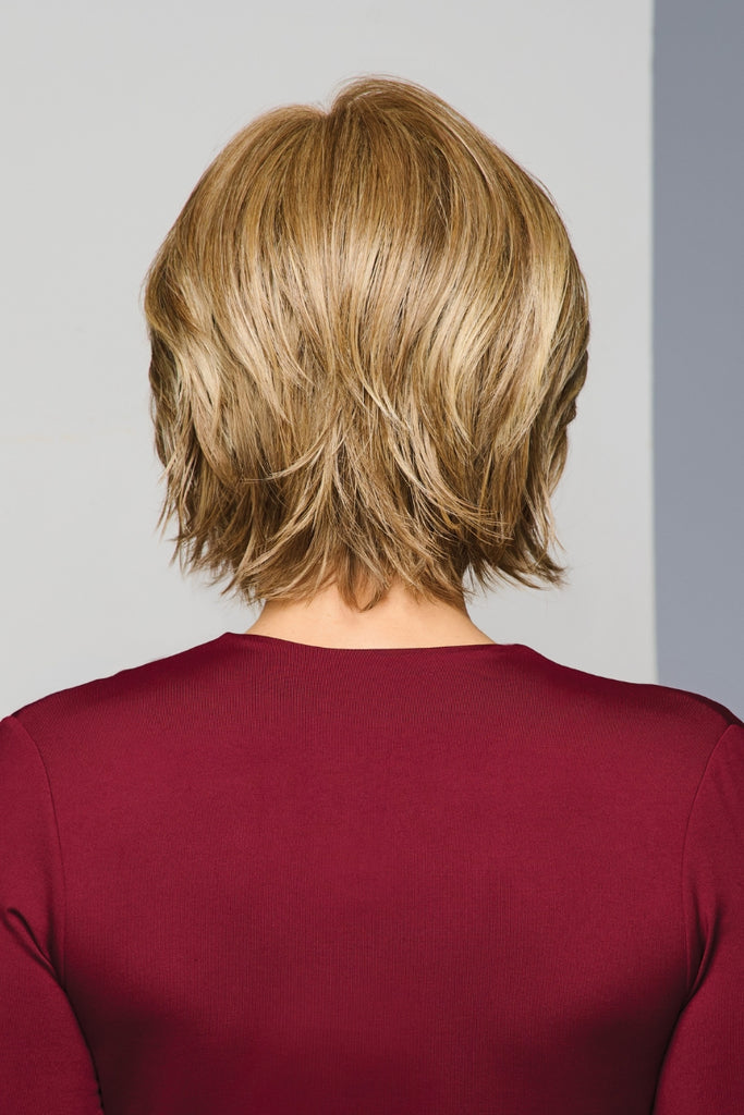 Back view of model styling Main Character in the color Golden Pecan.