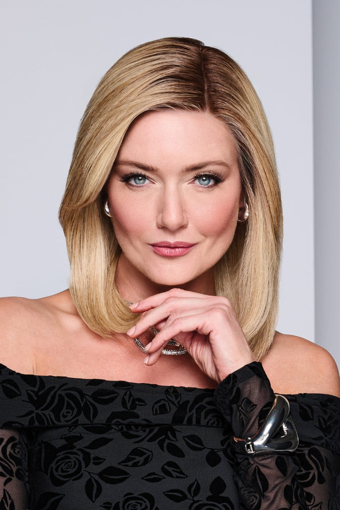 Model wearing a shoulder-length, layered style.