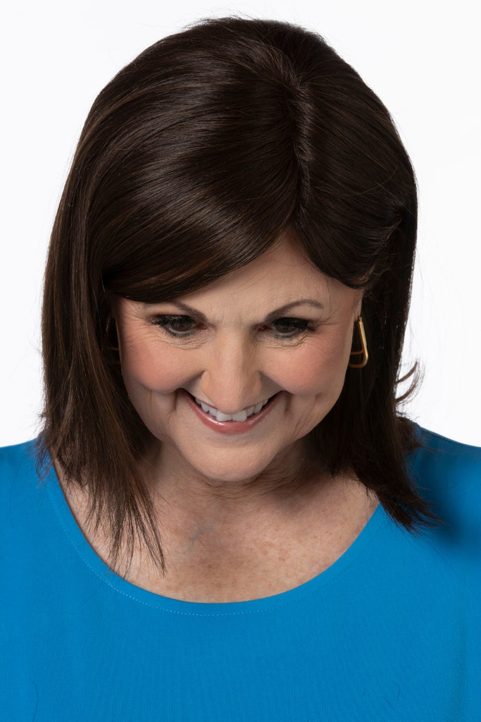 Woman wearing the medium length topper by Toni Brattin.