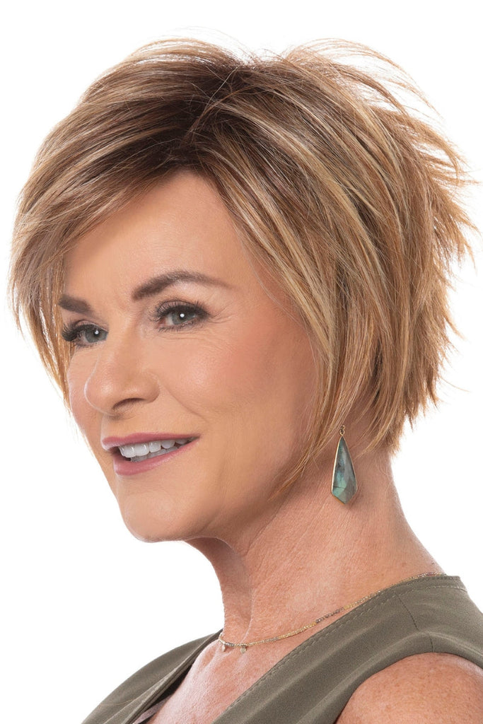 Side view of women styling an edgy and modern wig.