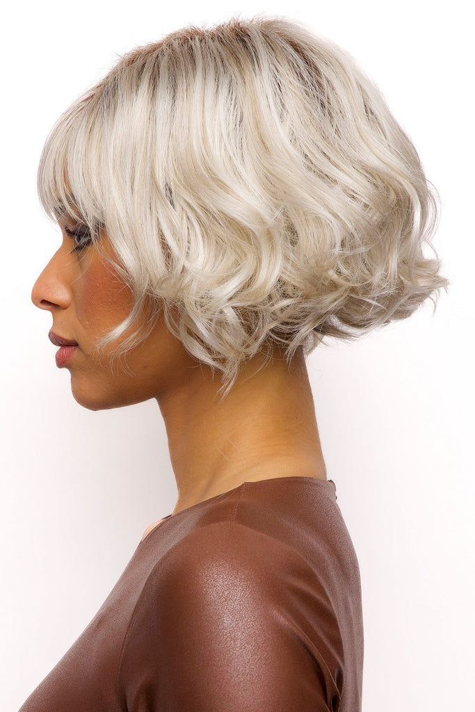 Model wearing the Rene of Paris wig Fenix (#2406) 4.